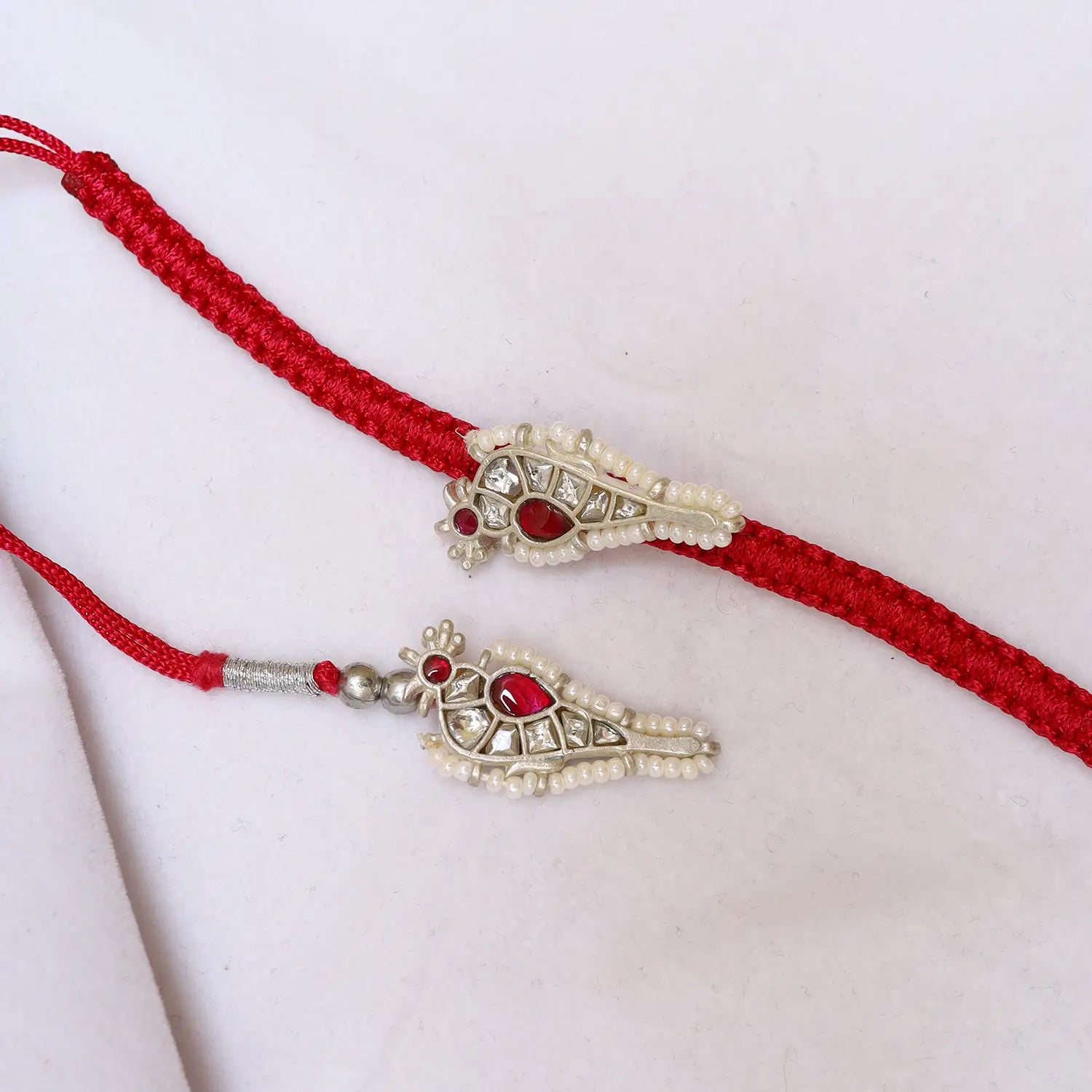 Premium Silver Rakhi with Ruby Stone & Pearl Detailing - Made With Pure 925 Silver