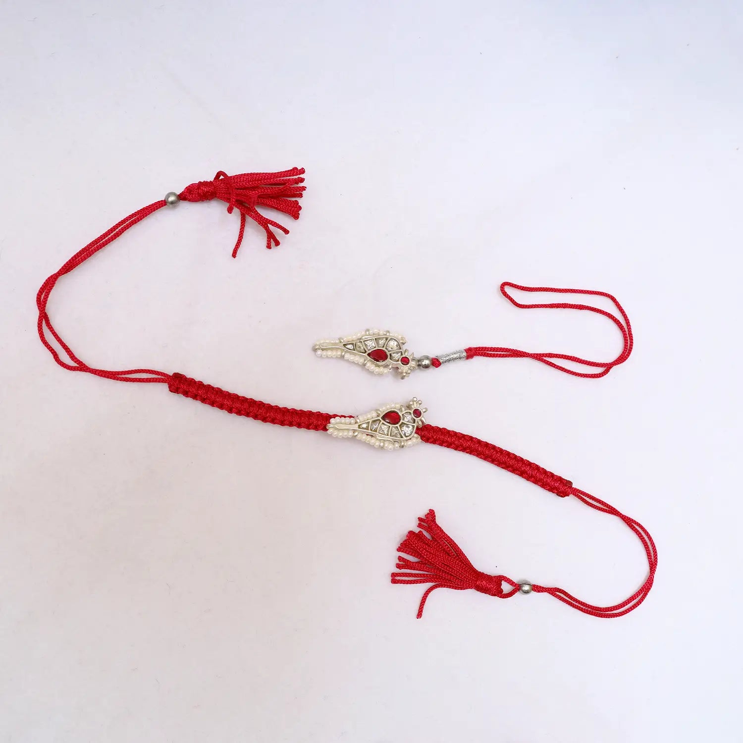 Premium Silver Rakhi with Ruby Stone & Pearl Detailing - Made With Pure 925 Silver