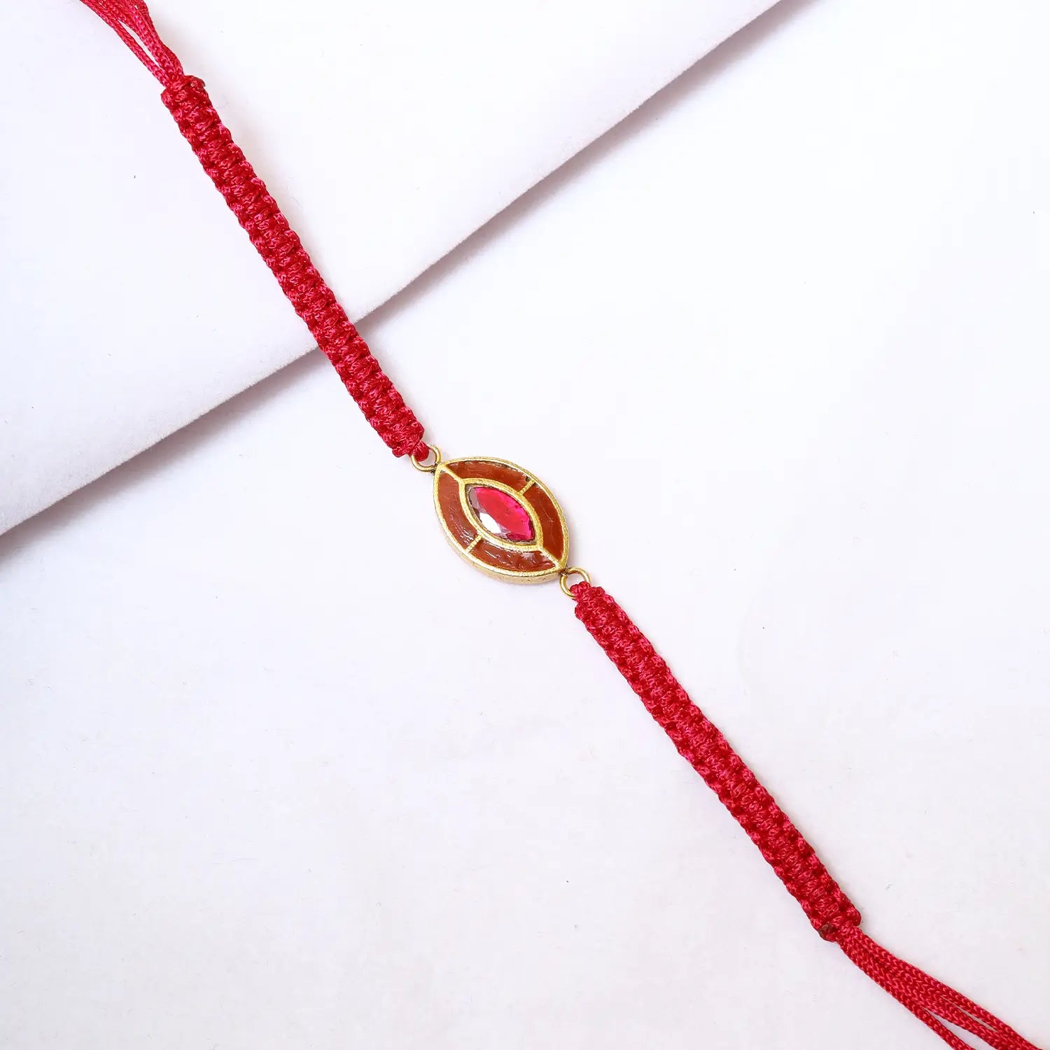 Elegant Silver Rakhi with Red Stone Accent - Made With Pure 925 Silver